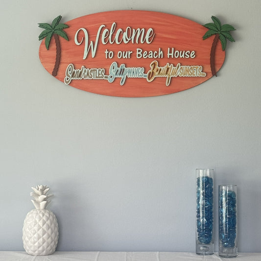 "Welcome to Our Beach House" – Hand Painted Surfboard-Style Wall Sign (25" x 12")